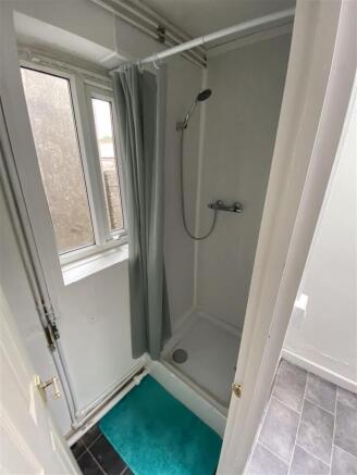 Bright bathroom with a convenient walk-in showe...