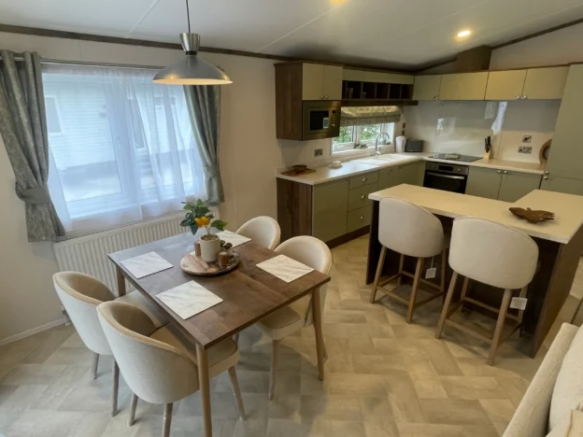 Spacious open plan lounge with vaulted ceilings in