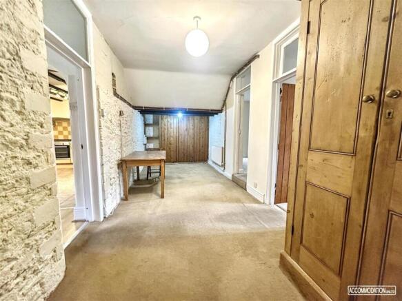 Expansive hallway with charming exposed brick...