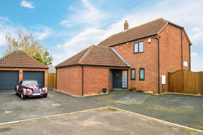 Detached double garage of No.7 plus ample off street parking