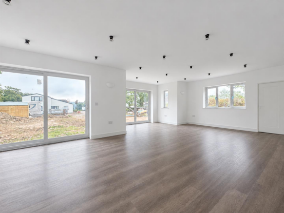 Freshly Painted White Open-Plan Room.png