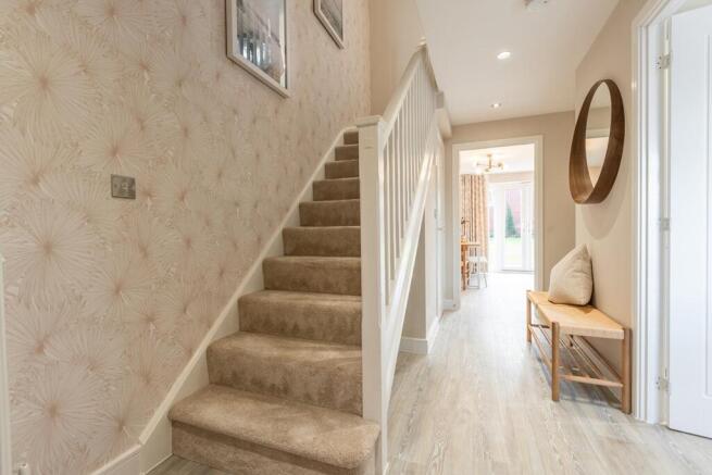 Entrance hallway with under stairs storage