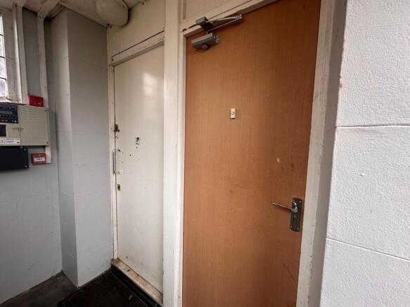 Interior entry area with two adjoining doors, c...