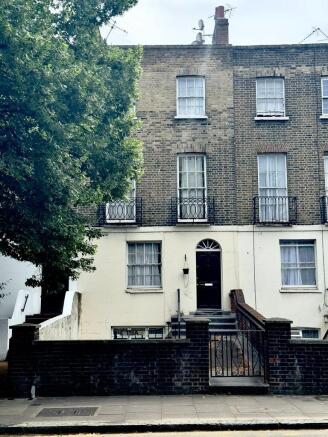 Elegant brick townhouse with classic architectu...