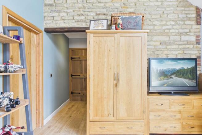 This room has it all... exposed brick, ensuite and