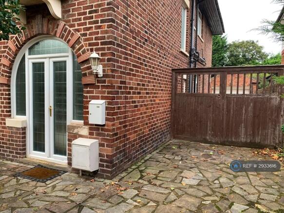 Front Door And Gate To Garage/Back Garden