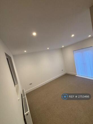 Spacious Living Room With Balcony Access