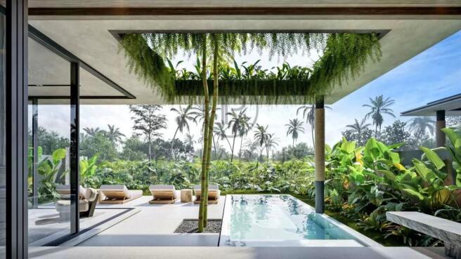 A modern, open-air living space features a pool su