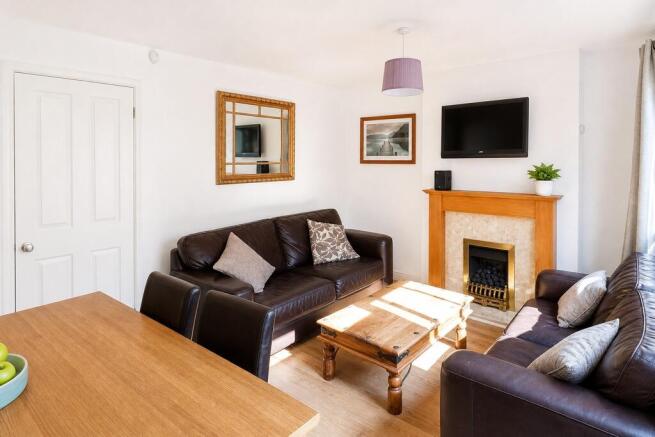 Bright and comfortable living room with sofas...