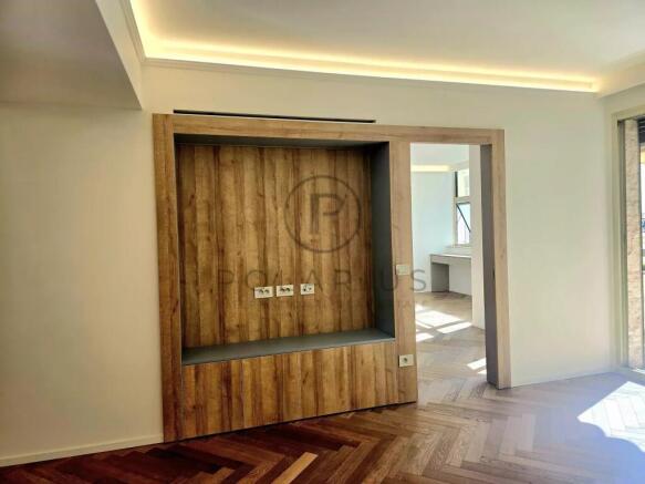 Modern minimalist room with a wooden accent wall, 