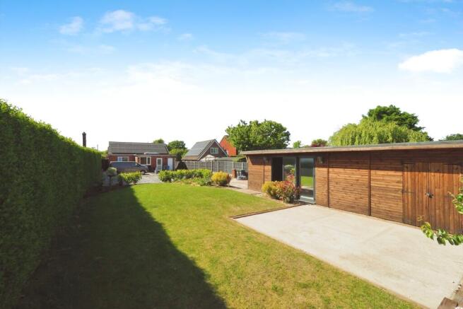 Beautiful Garden Space with Rear Driveway, Large Lawn and Large Log Cabin