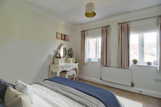 Bedroom Two has fitted wardrobes