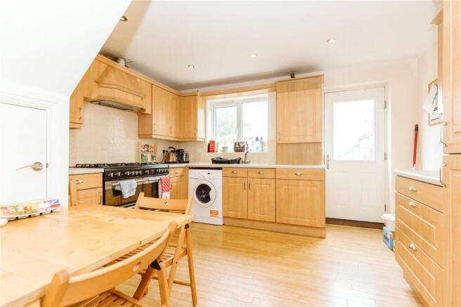 Bright and spacious kitchen featuring wooden ca...
