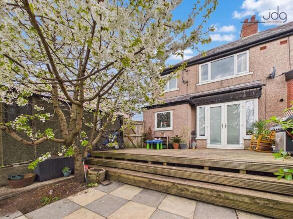 Spacious Garden with mixture of lawn, flags and decking
