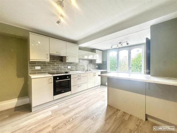 Bright modern kitchen with large breakfast bar...