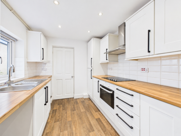Bright, clutter-free kitchen for letting