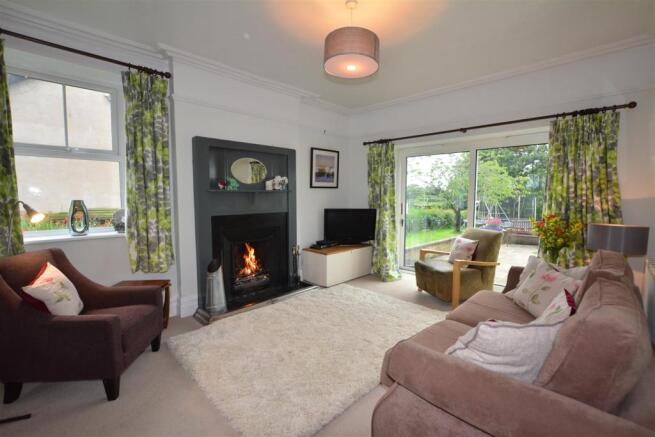 Family room with the open roaring fire