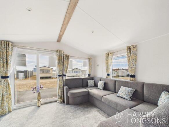 Bright lounge with corner sofa and large patio doo