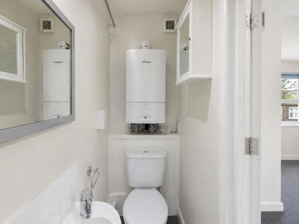 Clean and modern private toilet room with mirro...