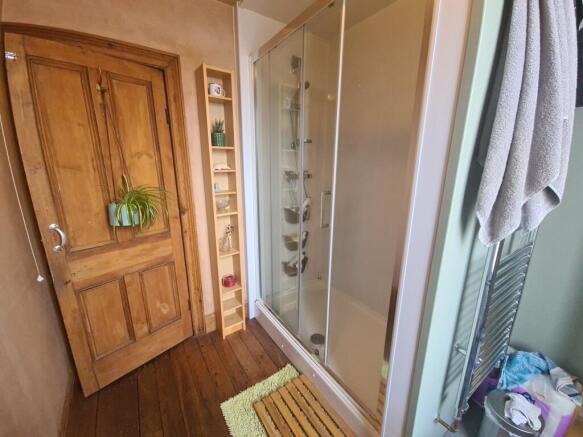A bright and well-maintained bathroom suite fea...