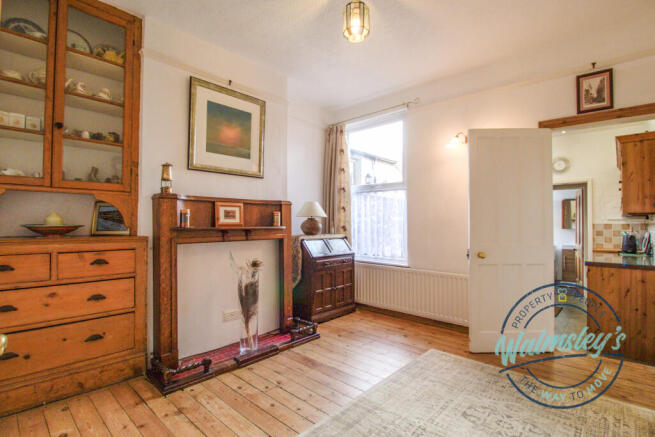 Rear sitting room with kitchen & bathroom beyond