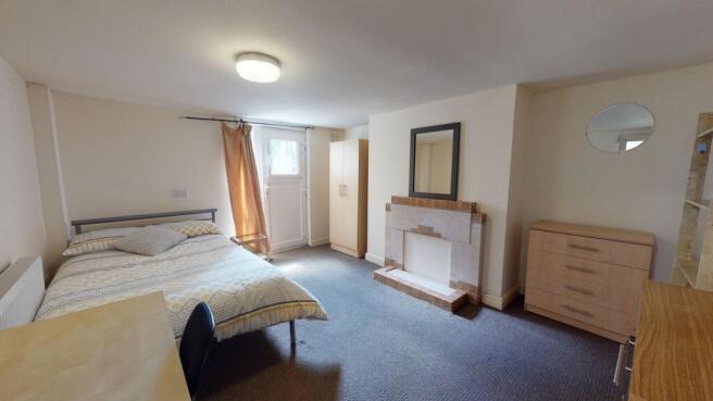 Bright and inviting master bedroom featuring a ...