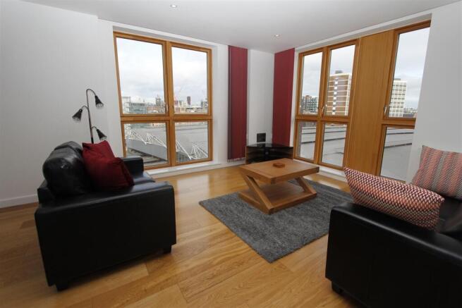 Bright modern lounge with expansive city views...