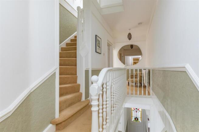 Stairs rising to Second Floor