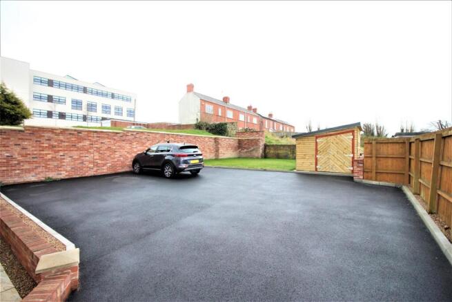 Expansive paved area with secure outdoor storag...
