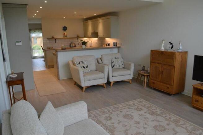 Sitting area through to kitchen