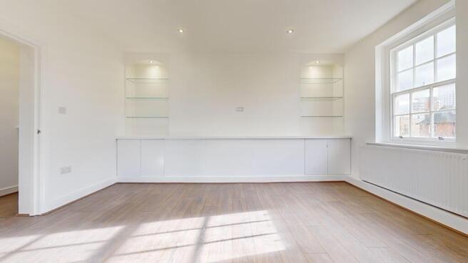 Bright modern living room with sleek shelving...