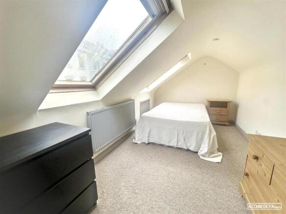Bright attic double bedroom with skylight...