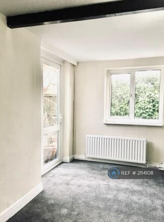 Lounge With French Door To Patio