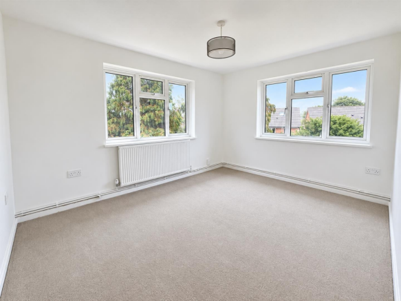 Bright Empty Room with Garden Views.png