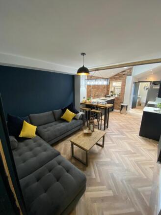 Modern and inviting living room featuring styli...