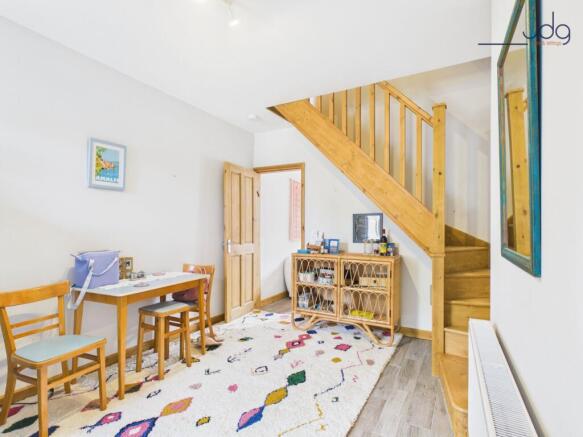 Dining Room with Wooden Stairs