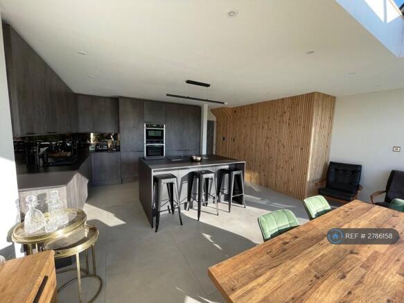 Oven & Microwave Oven Along With Pull Out Pantry.