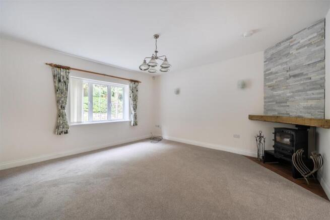 Lounge with wood burner and new carpets