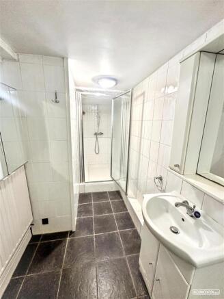 Bright bathroom with sleek walk-in shower...