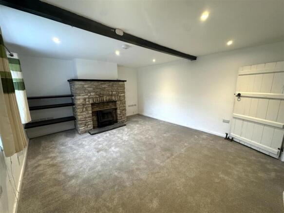 Sitting room with exposed beams