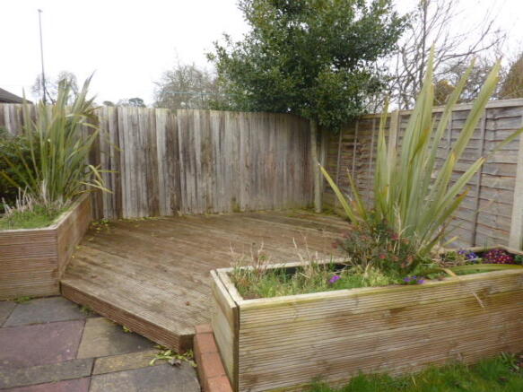 DECKED AND LANDSCAPED PATIO DINING AREA