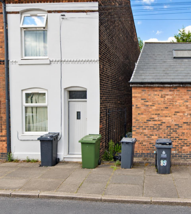 Terraced House with Wheelie Bins.png