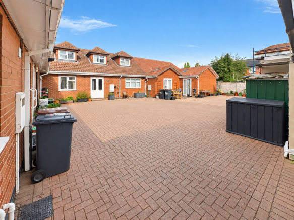 Sunlit Brick Courtyard Without Cars T202610141155.png