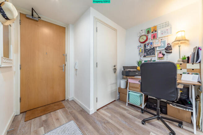 Entry phone and large storage cupboard