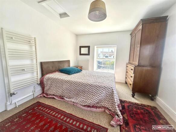 Bright double bedroom with ample storage space...