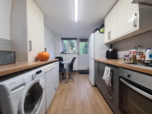 A bright, well-maintained kitchen featuring mod...