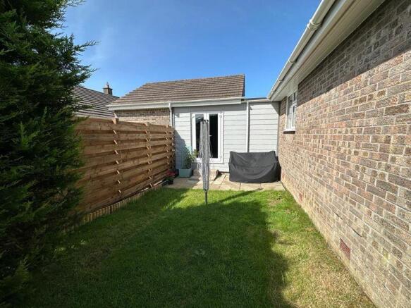 Side garden and rear access to garage