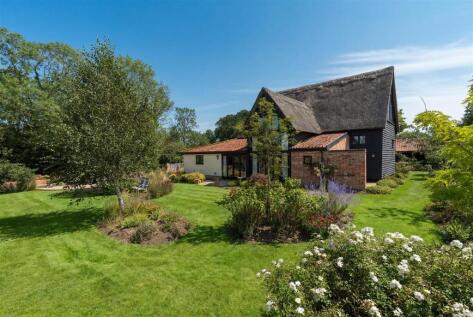 A striking barn in a peaceful countryside setting