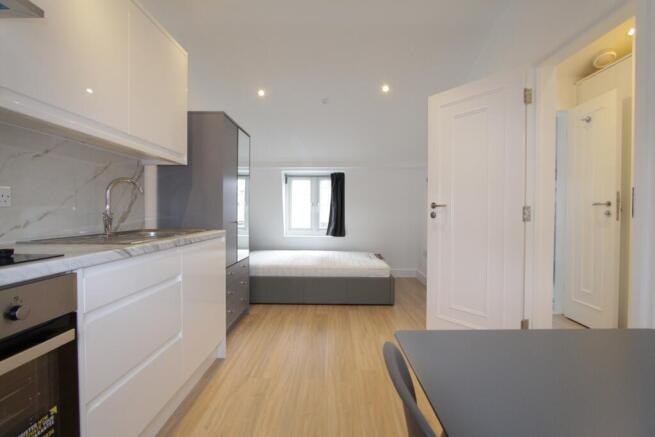 Modern open-plan studio with integrated kitchen...