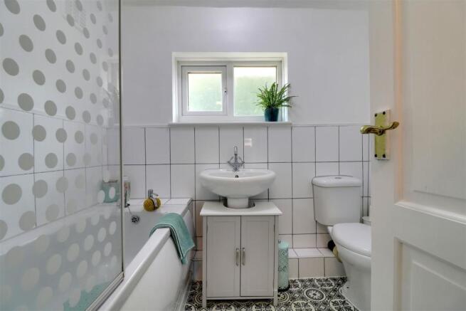 PARTLY TILED FAMILY BATHROOM/WC